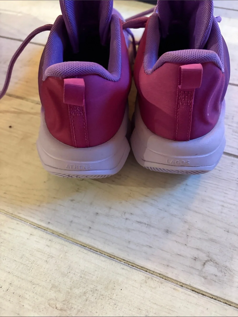 Nike Kids Purple Sneakers with Orange Swoosh